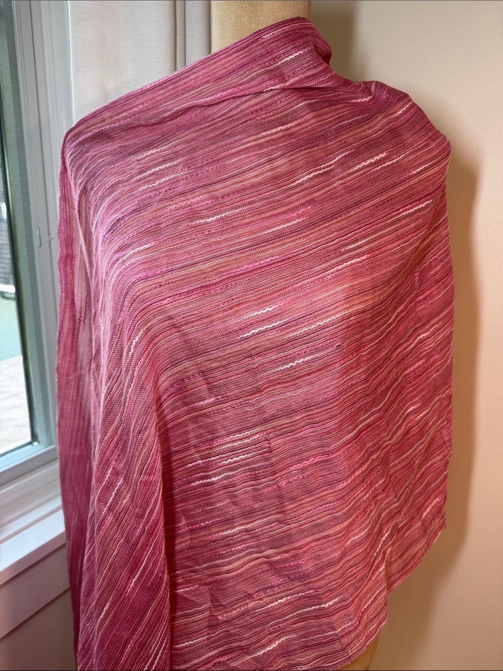 Unbranded pink and white textured light weight wrap.